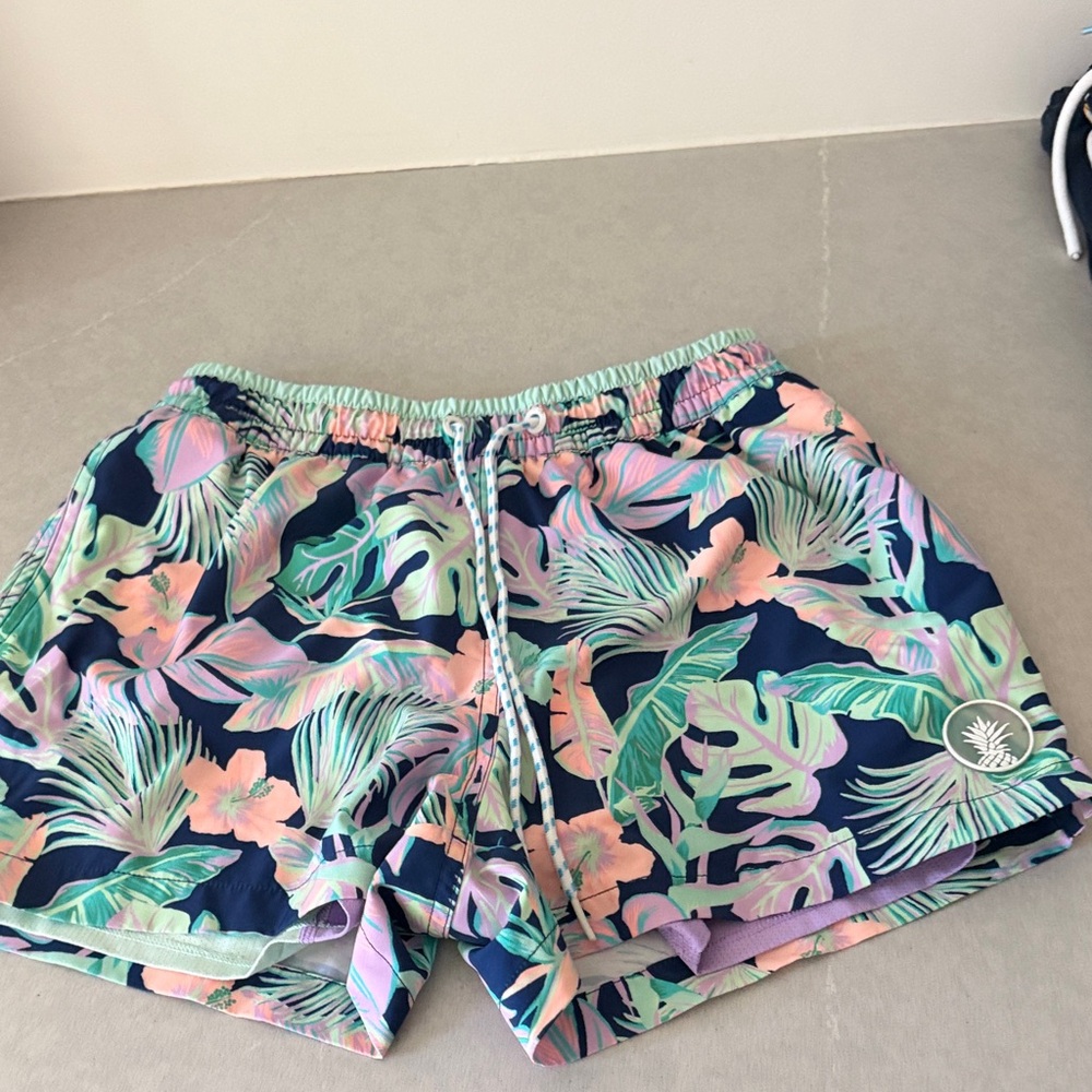 chubbies Navy Swim Trunks with Mint Green & Soft Pink Tropical Print